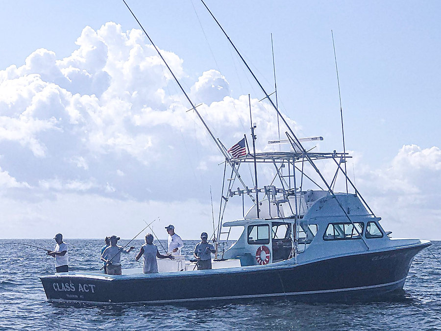 Class Act at work on the Bay, flag up