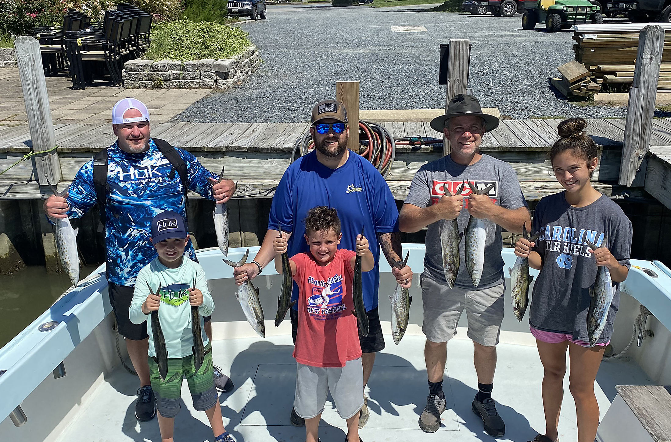 A family on the Class Act deck with their catch
